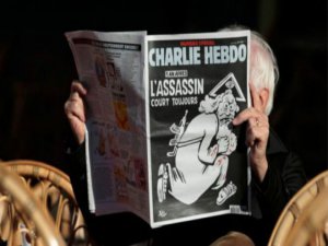 CHARLİE HEBDO'DAN TEPKİ ÇEKEN AYLAN KURDİ KARİKATÜRÜ