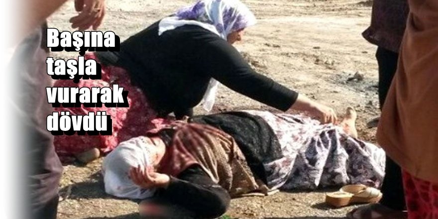 Diyarbakır'da karısını sokak ortasında başına taşla vurarak dövdü