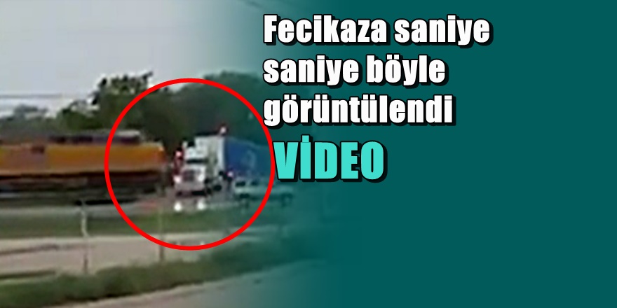 Demir yoluna sıkışan TIR'ı tren paramparça etti